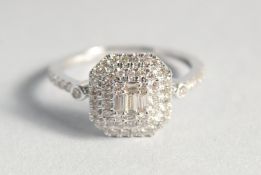 A 9ct. GOLD DIAMOND SET DECO STYLE SQUARE RING.