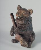 A COLD PAINTED BEAR MATCH HOLDER, 7 cm.