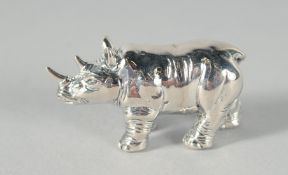 A CAST SILVER RHINO PIN CUSHION, 3.5 cm.