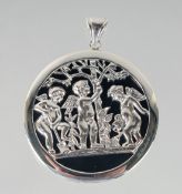 A SILVER AND ONYX CUPID PENDANT, 4 cm.