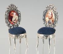 A PAIR OF SILVER AND ENAMEL CHAIR PIN CUSHIONS, 4 cm.