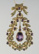 A GOLD PLATED SILVER, AMETHYST, AND PERIDOT PENDANT AND CHAIN.