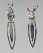 TWO SILVER RABBIT BOOK MARKERS.