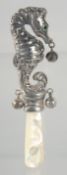 A NOVELTY SILVER SEAHORSE AND MOTHER OF PEARL RATTLE.