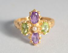 A SILVER GOLD PLATED PERIDOT, AMETHYST, AND PEARL SUFFRAGETTE STYLE RING.