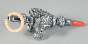 A SILVER AND CORAL BABY RATTLE.