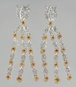 A GOOD PAIR OF 18ct. WHITE GOLD YELLOW AND WHITE DIAMOND THREE ROW TASSEL DROP EARRINGS.