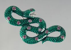 A SILVER AND ENAMEL RUBY SNAKE BROOCH / PENDANT.