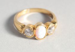 A SILVER 18ct. GOLD PLATED OPAL AND CUBIC ZIRCONIA RING.