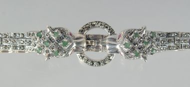 A SILVER EMERALD SET PANTHER BRACELET.