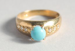 A SILVER GOLD PLATED TURQUOISE RING.