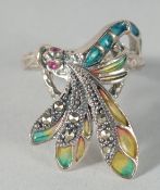 A SILVER AND MARCASITE PLIQUE-A-JOUR DRAGONFLY RING.