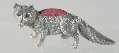 A SOLID SILVER FOX PIN CUSHION, 5.5 cm.