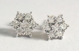 A VERY GOOD PAIR OF 9ct. GOLD DIAMOND CLUSTER EARRINGS.