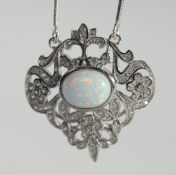 A SILVER OPAL PENDANT AND CHAIN.
