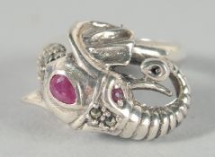 A SILVER RUBY SET ELEPHANT RING.