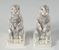 A PAIR OF SILVER PLATED RABBIT SALT AND PEPPERS, 5.5 cm.