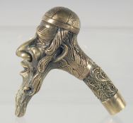 A BRASS JUDAICA WALKING STICK HANDLE.