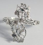A SILVER NATURALISTIC DRAGONFLY BANGLE.