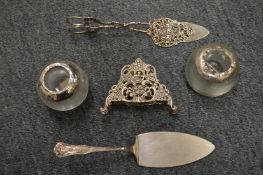 Two silver topped match strikers and other items.