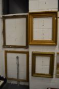 Four gilt picture frames.
