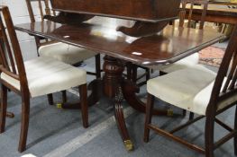 A mahogany tilt top pedestal dining table.