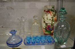 A pale green cut glass decanter and stopper and other glassware.