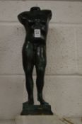 After the antique, a bronze male torso on a marble base.