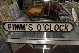 A novelty carved and painted wood sign.