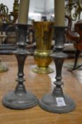 A pair of pewter candlesticks.