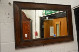 An oak framed mirror.