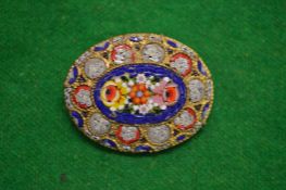 A micro mosaic brooch.