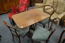 A set of three and one similar Victorian walnut dining chairs.