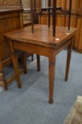 A small oak draw leaf table.