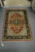 A Persian part silk rug with stylised floral decoration 138cm x 91cm.