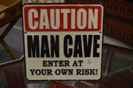 A novelty cast iron sign.