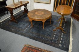A Persian style carpet, blue ground with stylised decoration (slight moth damage) 275cm x 185cm.