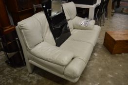 A modern leather two seat sofa.