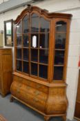 A good Dutch marquetry inlaid walnut bombe display cabinet on chest.