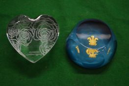 A Saint Louis glass paperweight depicting the Prince of Wales Feathers together with a Waterford