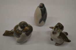 A Copenhagen penguin and two birds.