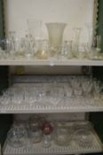Three shelves of glassware.