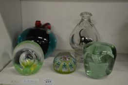 A small group of glass paperweights.