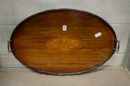 An Edwardian inlaid mahogany oval twin handled tray.