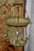 An ornate brass and glass hall lantern.