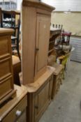 Two pine corner cupboards.