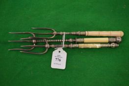 Three silver plated bread forks.