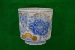 A small Japanese porcelain cup.