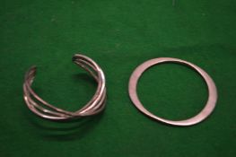Two designer silver bracelets.