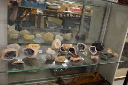 A collection of crystal and rock specimens.